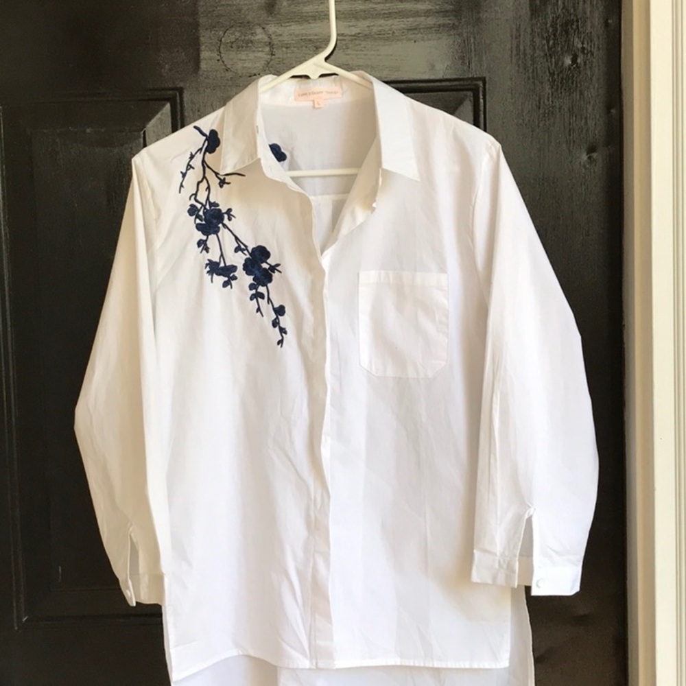 Navy blue embroidered flowers make this ordinary white blouse extraordinary!